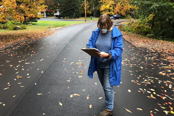 Planned Parenthood volunteer Sarah Mahoney checks a list of addresses in Windham, Maine to see which door to knock on next.