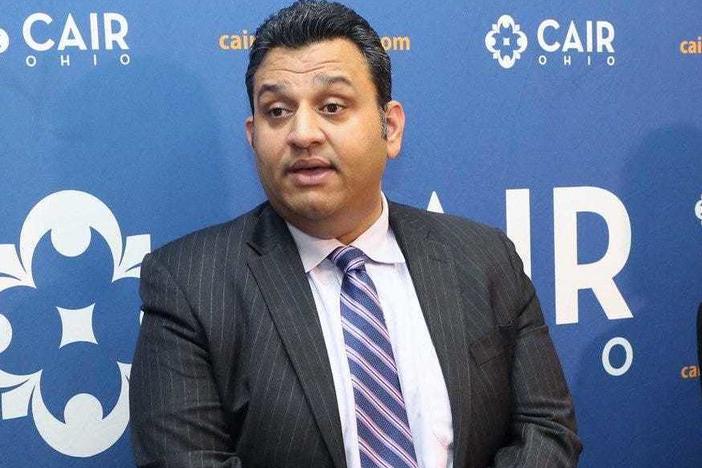 Romin Iqbal (center) of the Council on American-Islamic Relations (CAIR) attends a press conference at CAIR-Columbus headquarters in Columbus, Ohio, in 2018. Iqbal was terminated for sharing information about the organization to "a known anti-Muslim hate group."