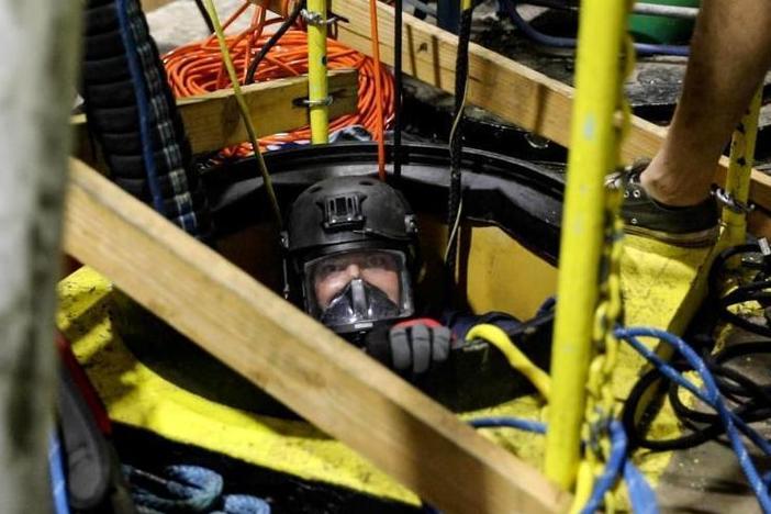 This Dec. 11, 2021 photo, provided by the U.S. Navy, shows a diving salvage unit at work in a contaminated water well near Pearl Harbor, Hawaii.