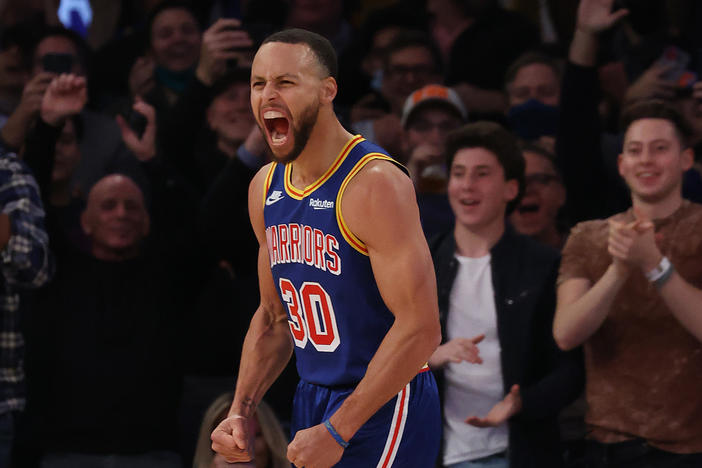 Golden State Warriors point guard Steph Curry celebrates after making a 3-point basket to break Ray Allen's record during a game against the New York Knicks on Tuesday.