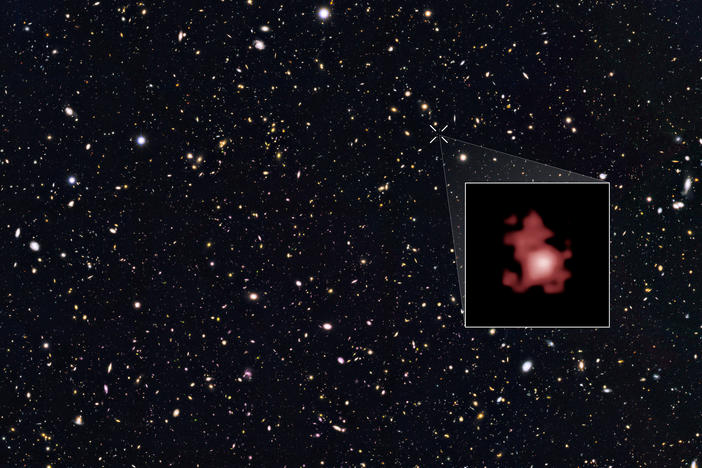 The most distant galaxy ever discovered, GN-z11, is shown within a Hubble Space Telescope deep sky survey and highlighted in the inset. This galaxy existed only 400 million years after the Big Bang.