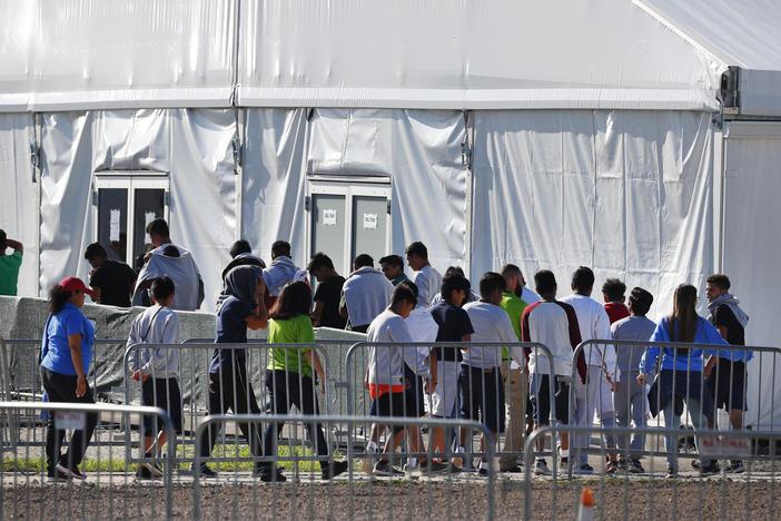 Children line up to enter a tent at the Homestead Temporary Shelter for Unaccompanied Children in Homestead, Fla., in Feb. 2019 The American Civil Liberties Union and other attorneys filed a lawsuit on behalf of thousands of immigrant families who were separated at the U.S.-Mexico border on Oct. 3, 2019.