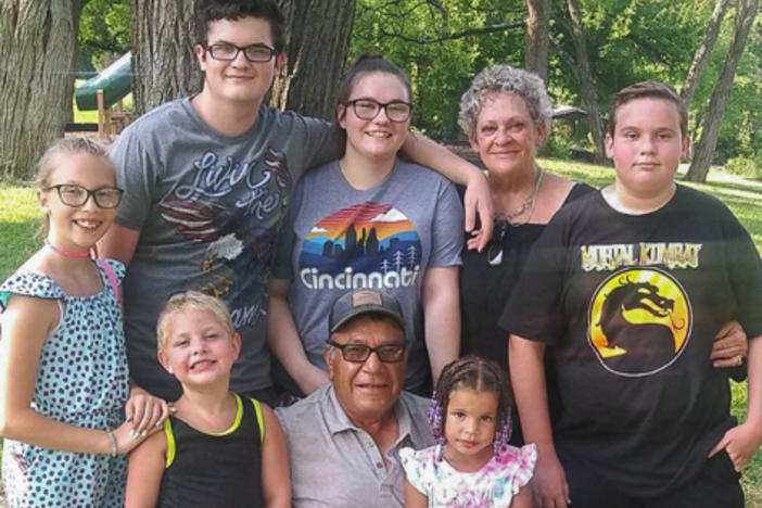 Jesus and Suzanne Valle pose with their adopted children in Art Van Atta Park in Dayton, Ohio, in July. "I always like to tell everybody we raised yours, mine, ours, my brother's, now others," Suzanne says.