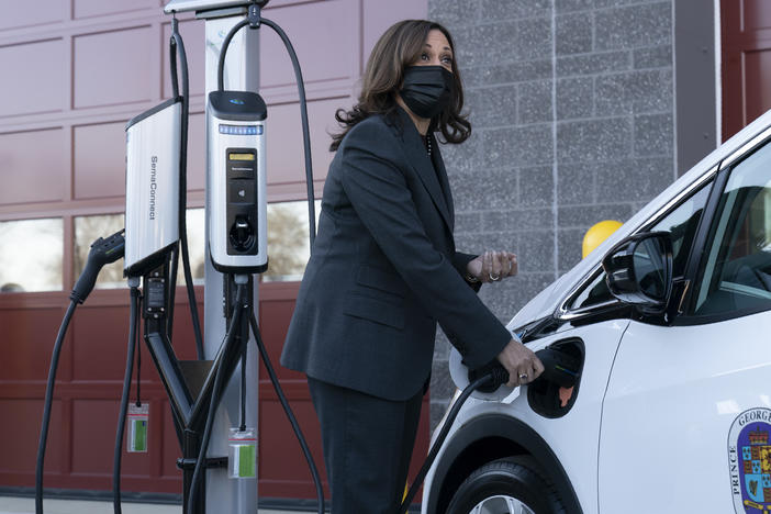 Vice President Harris charges an electric vehicle during a tour of the Brandywine Maintenance Facility in Prince George's County, Md. There, she highlighted electric vehicle investments.