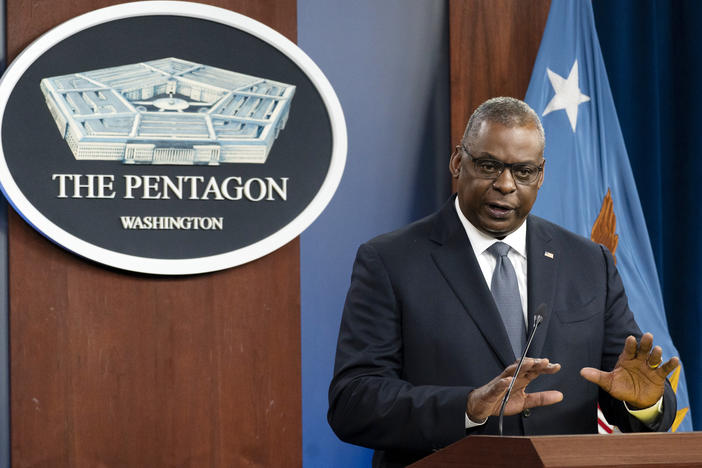Secretary of Defense Lloyd Austin speaks during a media briefing at the Pentagon last month. The military branches have begun discharging people who refuse to get vaccinated against COVID-19.