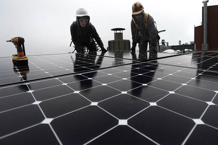 The Build Back Better legislation included billions to accelerate clean energy like rooftop solar, but with the bill now stalled in Congress, cutting U.S. emissions will be tougher.