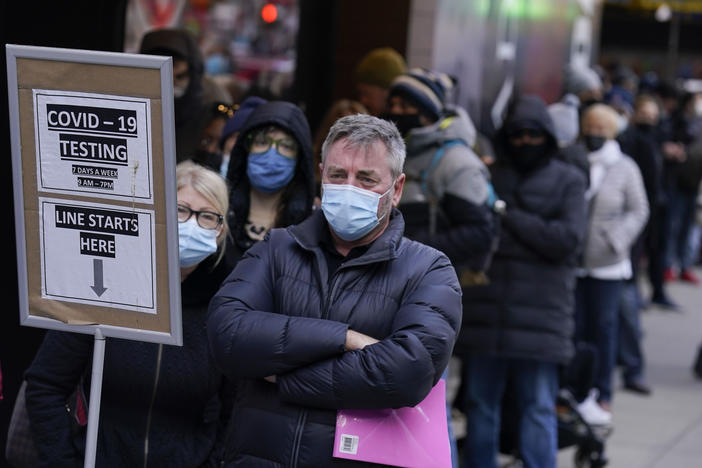 People wait in line at a coronavirus testing site in Times Square in New York on Dec. 13.