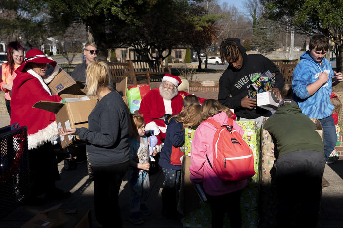 Volunteers and community members attend the WPKY toy drive in Princeton, Ky.
