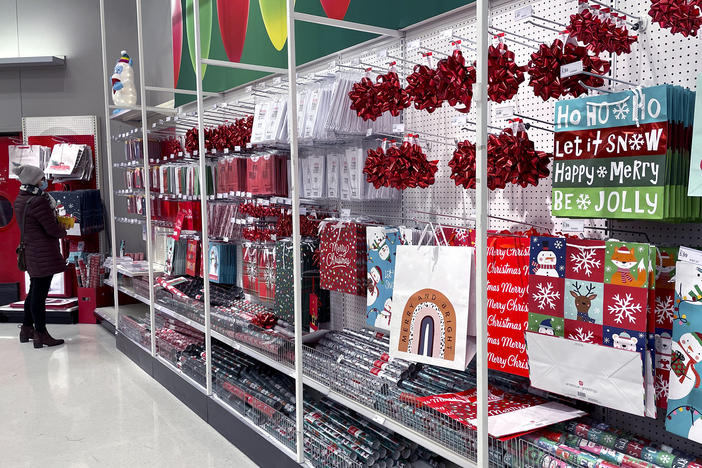 A shopper shops at a retail store in Glenview, Ill., Dec. 16. The National Retail Federation, the nation's largest retail trade group, said this month that the holiday shopping season appears to be on pace to exceed its sales growth forecast of between 8.5% and 10.5% despite additional challenges this year, from a new variant of the coronavirus, to soaring inflation.