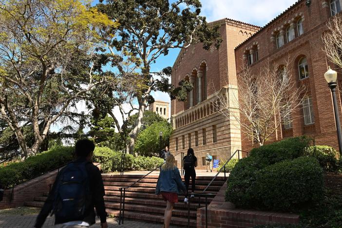 Students walk on the campus of University of California at Los Angeles (UCLA) in Los Angeles in March 2020.