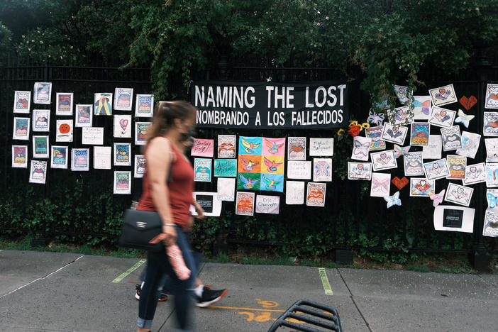 Memorials hang from the front gate of Greenwood Cemetery during an event and procession organized by Naming the Lost Memorials to remember and celebrate the lives of those killed by the COVID-19 pandemic on June 8 in New York City.