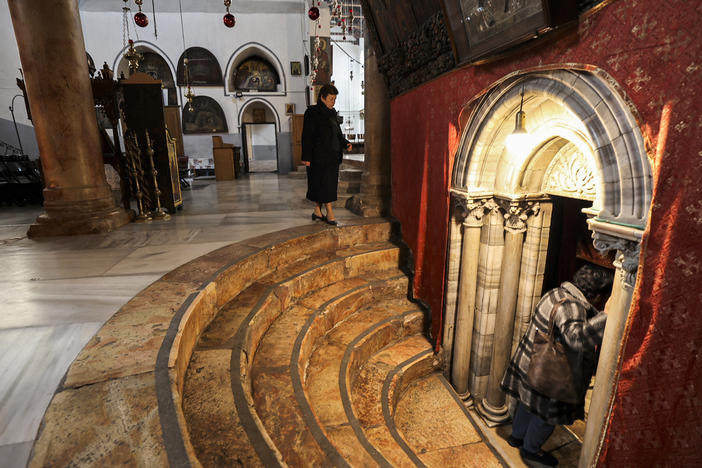 A handful of visitors tour the Church of the Nativity, traditionally believed to be the birthplace of Christ, in the biblical West Bank city of Bethlehem, on Dec. 15.