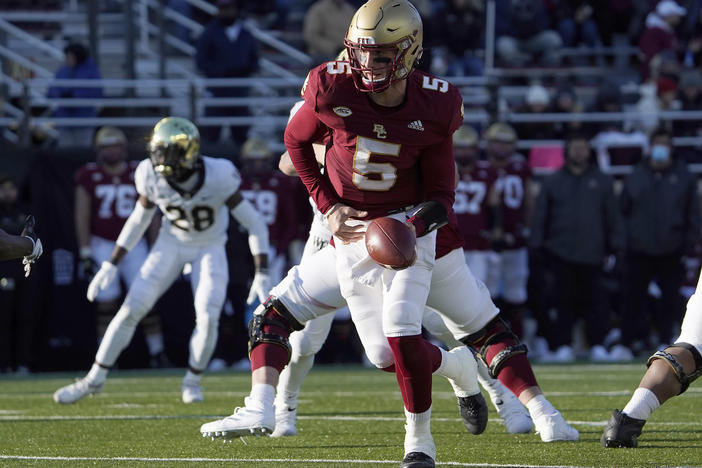 Boston College quarterback Phil Jurkovec prepares to hand the ball off during the second half of an NCAA college football game against Wake Forest on Saturday, Nov. 27 in Boston. The Fenway Bowl and Military Bowl have been canceled due to the pandemic as coronavirus outbreaks at Virginia and Boston College forced them to call off their postseason plans.