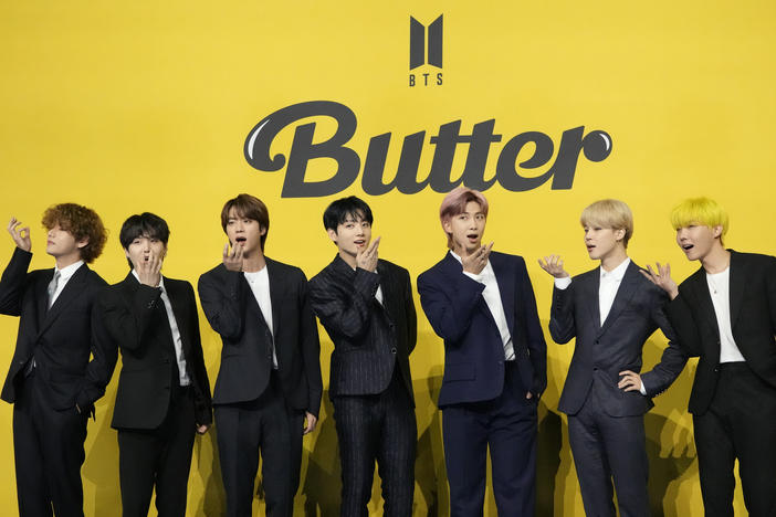 Three members of the K-pop superstar group BTS have been infected with the coronavirus, their Big Hit Entertainment agency said. Members of the group are seen here at a news conference to introduce their single "Butter," in May. They are, from left to right: V, Suga, Jin, Jungkook, RM, Jimin, and J-Hope.