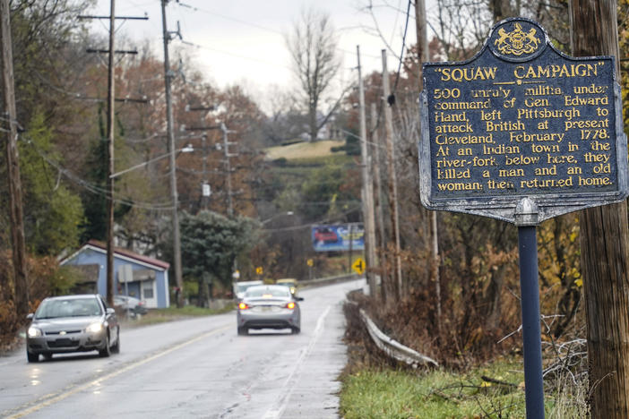 A Pennsylvania Historical and Museum Commission plaque is seen along a roadside in New Castle, Pa. A recent review of all 2,500 markers has resulted in the state removing two markers, revising two and ordering new text for two others so far.