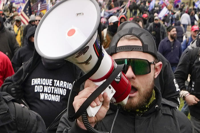 Proud Boys walk toward the U.S. Capitol in Washington in support of President Donald Trump on Jan. 6, 2021. A federal judge has refused to dismiss an indictment charging four alleged leaders of the group with conspiring to attack the Capitol.