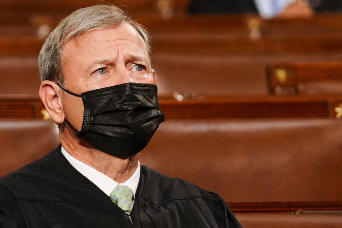 Chief Justice John Roberts listens as President Biden addresses a joint session of Congress on April 28.