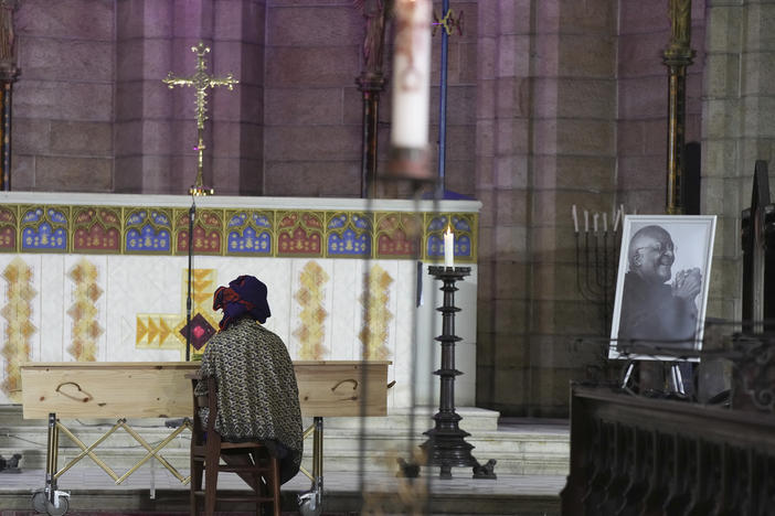 Mpho Tutu, sits with the coffin of her father, Anglican Archbishop Emeritus Desmond Tutu, during his funeral at the St. George's Cathedral in Cape Town, South Africa, on Saturday.