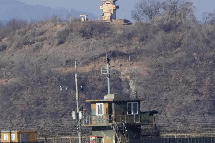 Military guard posts of North Korea, rear, and South Korea, front, are seen in Paju, near the border with North Korea, South Korea, Sunday, Jan. 2, 2022.