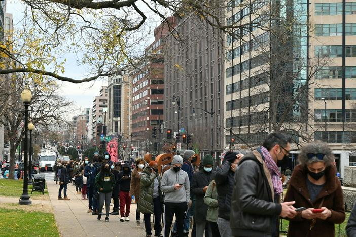 People line up to get tested for COVID-19 in Washington, D.C., on Wednesday. More than 1 million positive COVID-19 tests were recorded in the U.S. on Monday, according to data from Johns Hopkins University.