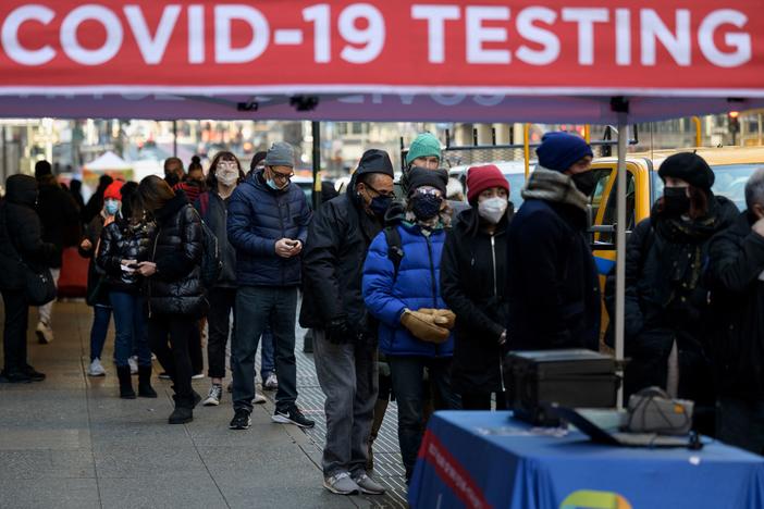 People wait in line to receive a COVID-19 test on Tuesday in New York. The U.S. recorded more than 1 million COVID-19 cases on Monday.