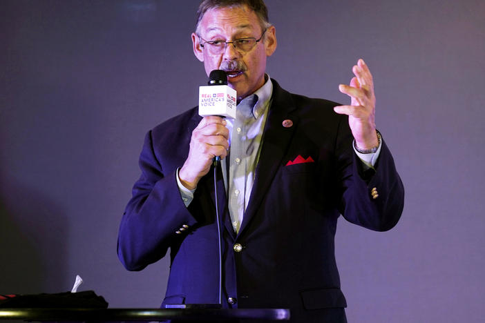 Rep. Mark Finchem, of Arizona, gestures as he speaks during an election rally in Richmond, Va., in October.