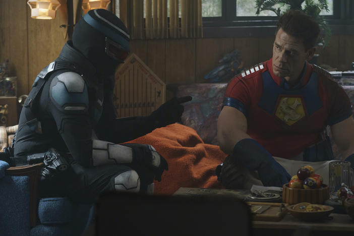 L to R: Vigilante (Freddie Stroma) and Peacemaker (John Cena) play mercs who are jerks in <em>Peacemaker</em>.