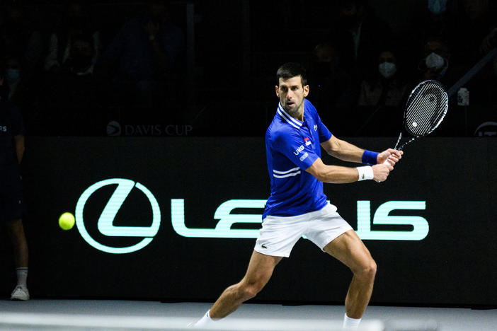Novak Djokovic of Serbia plays a backhand against Marin Cilic of Croatia during the Davis Cup Semi Final match between Croatia and Serbia at Madrid Arena pavilion in December in Madrid, Spain.