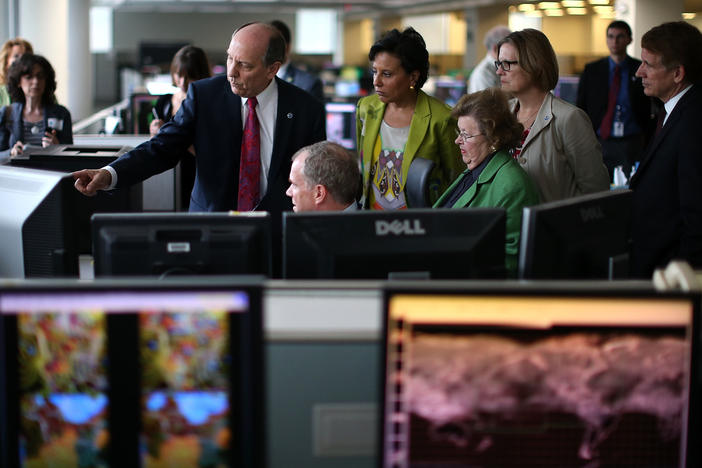 In this 2013 photo, National Weather Service Director Louis Uccellini (left) gives a tour of NOAA's Center for Weather and Climate Prediction to Commerce Secretary Penny Pritzker (second from left), Maryland Senator Barbara Mikulski (D-MD) (third from right), NOAA Acting Administrator Kathryn Sullivan (second from right), and Bryan Norcross (right) of the Weather Channel.