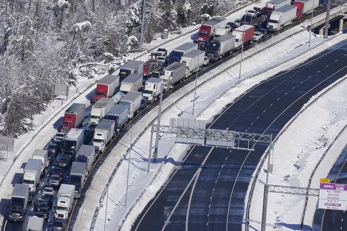 Cars and trucks are stranded on sections of Interstate 95 Tuesday Jan. 4, 2022, near Quantico, Va. Close to 48 miles of the Interstate was closed due to ice and snow.