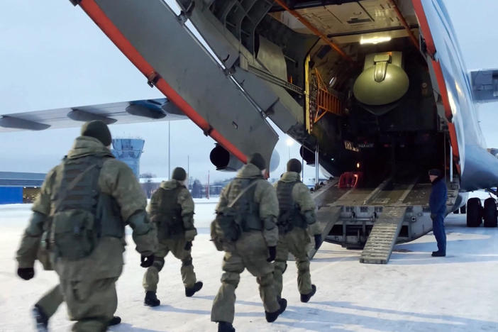 In this photo taken from video, Russian peacekeepers board a Russian military plane at an airfield outside Moscow to fly to Kazakhstan on Thursday. A Russia-led military alliance, the Collective Security Treaty Organization, said early Thursday that it would send peacekeeper troops to Kazakhstan.