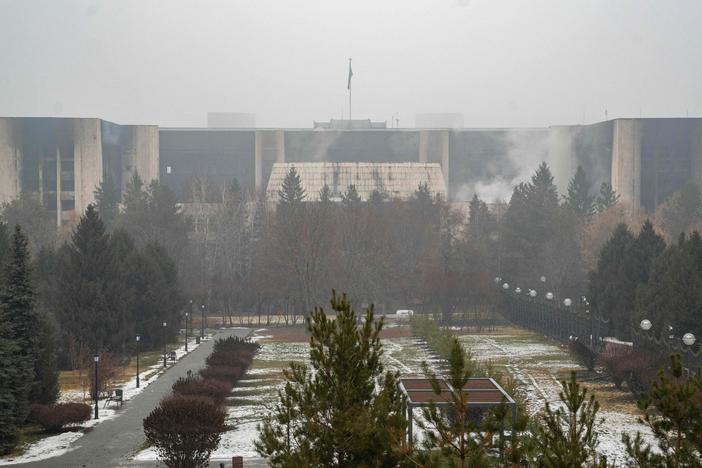 The burned-out administrative building in Almaty, Kazakhstan's largest city, can be seen Friday. The country's president has rejected calls for talks with protesters after days of unprecedented unrest, vowing to destroy "armed bandits."