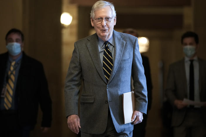 Senate Minority Leader Mitch McConnell, R-Ky., walks to the Senate floor at the U.S. Capitol on Wednesday. McConnell says he may be open to reforming the Electoral Count Act.