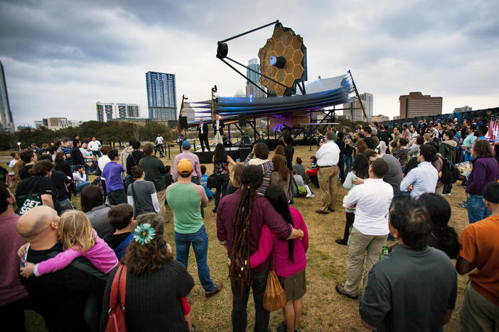 A crowd gathers as Nobel laureate John Mather and Northrop Grumman engineer Scott Willoughby speak in front of a model of NASA's James Webb Space Telescope at South by Southwest on March 9, 2013.