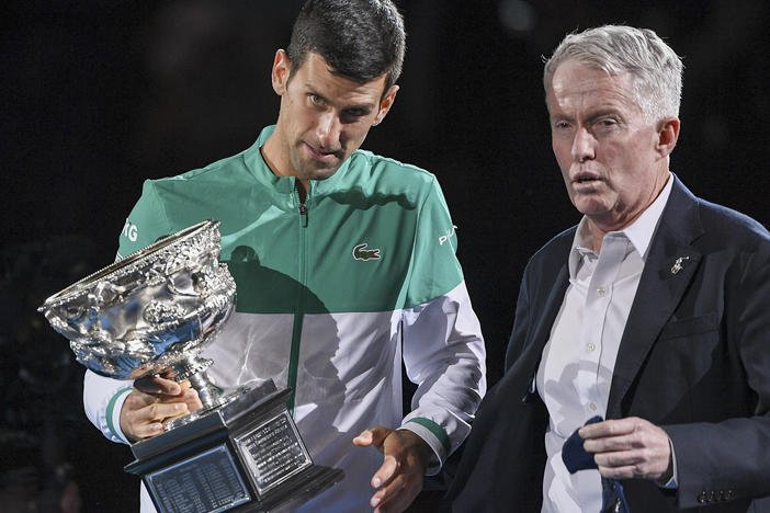 Novak Djokovic stands with Australian Open tournament director Craig Tiley during the trophy presentation at the Australian Open tennis championships in Melbourne, Australia, last February.