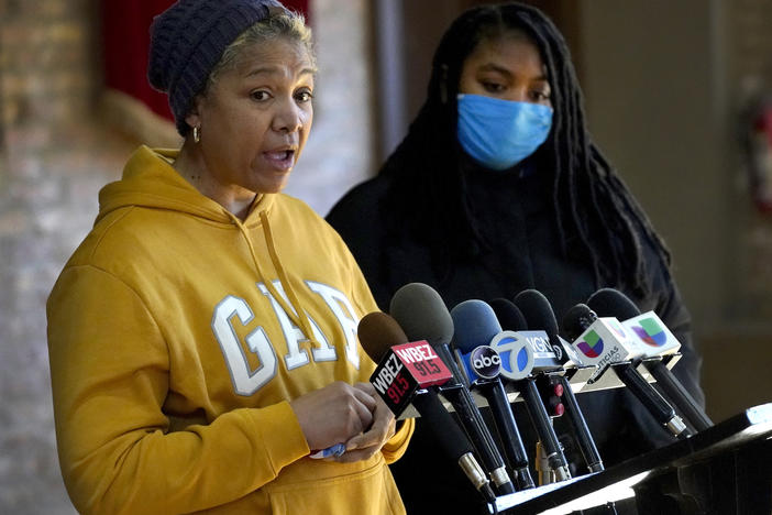 Cheri Warner (left) stands with her daughter, Brea, and speaks on Monday to fall for the Chicago school district and teacher's union to focus on getting students back in the classroom in Chicago.