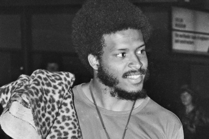 James Mtume, left, and Miles Davis arrive at Heathrow Airport in London on July 10, 1973.