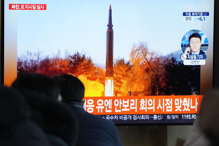 People watch a TV showing a file image of North Korea's missile launch during a news program at the Seoul Railway Station in Seoul, South Korea, on Tuesday.