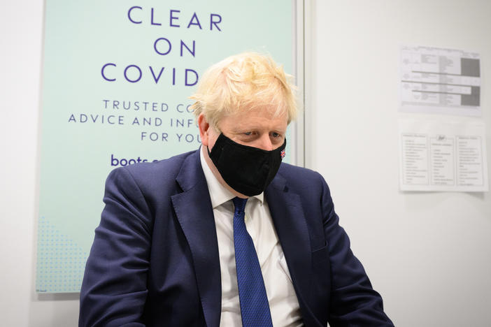 A 2020 email from British Prime Minister Boris Johnson's private secretary shows that 10 Downing Street hosted a private party, at a time when the country was under lockdown. Johnson is seen here visiting a pharmacy in his home constituency of Uxbridge, England, on Monday.