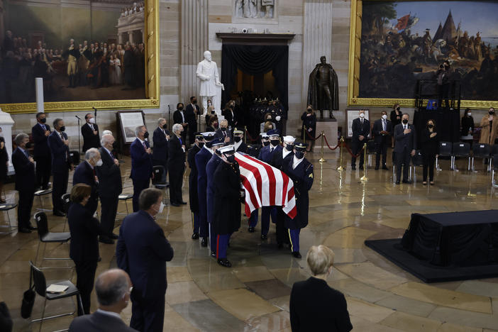 A U.S. Joint Forces bearer team carries the flag-draped casket of former Senate Majority Leader Harry Reid, D-Nev., into the Rotunda of the U.S. Capitol where he will lie in state on Wednesday.