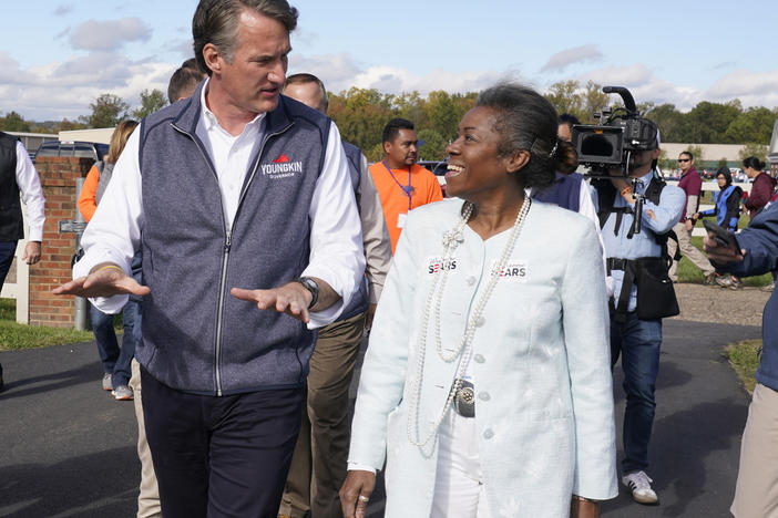 Virginia's Gov.-elect Glenn Youngkin, pictured on the campaign trail, speaks with now Lt. Gov.-elect Winsome Sears after a rally in Fredericksburg, Va., Oct. 30, 2021. Youngkin and Sears, both Republicans, won election on Nov. 2, and will be sworn into office Jan. 15, 2022.