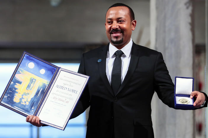 Ethiopia's Prime Minister Abiy Ahmed poses for the media after receiving the Nobel Peace Prize in Oslo, Norway, on Dec. 10, 2019. The Norwegian Nobel Committee on Thursday  issued a very rare admonition to Abiy over the war and humanitarian crisis in his country's Tigray region.