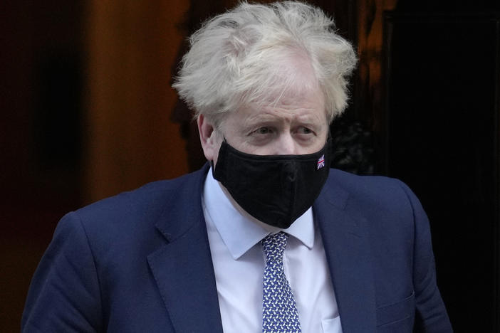 Britain's Prime Minister Boris Johnson leaves Downing Street to attend the weekly session of Prime Ministers Questions in London on Wednesday.