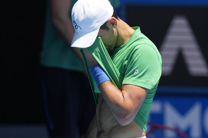 Defending men's champion Novak Djokovic practices at Margaret Court Arena ahead of the Australian Open tennis championship in Melbourne, Australia, on Jan. 13, 2022.