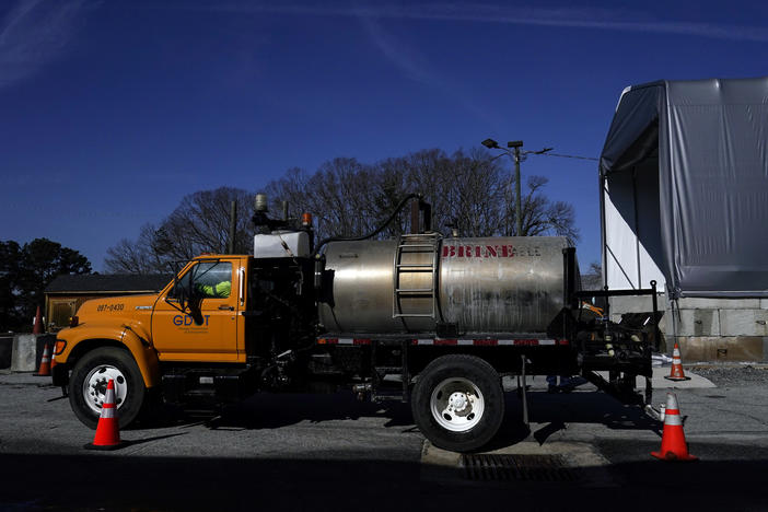 A Georgia Department of Transportation brine tank is filled Friday in Forest Park, Ga., ahead of a winter storm that's poised to drop several inches of snow across the South