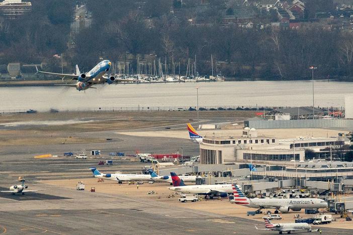 An Alaska Airlines plane takes off from Ronald Reagan National Airport in Arlington, Va., on Tuesday.