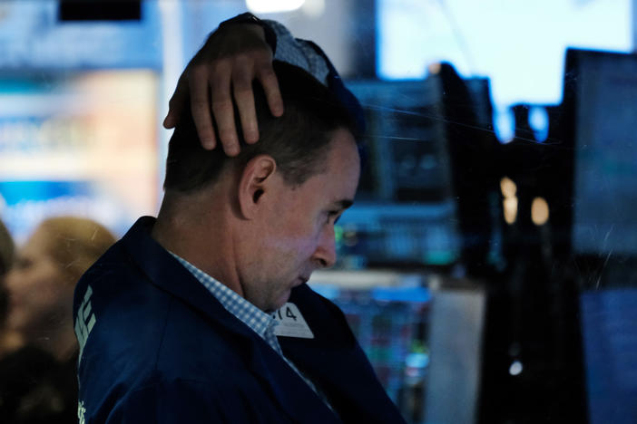 A trader works on the floor of the New York Stock Exchange on Oct. 4, 2021, in New York City. Stocks and bonds have tumbled this year as a spike in inflation has investors bracing for higher interest rates.