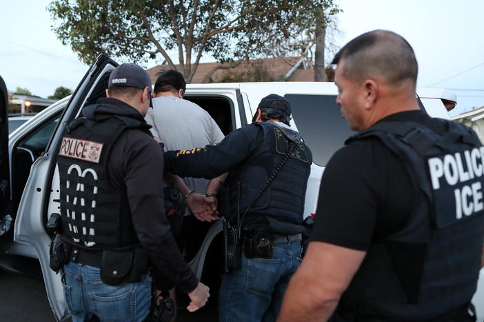 U.S. Immigration and Customs Enforcement's fugitive operations team makes an arrest at a home in Paramount, Calif., on March 1, 2020.