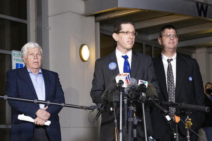 Charlie Cytron-Walker, rabbi of Congregation Beth Israel, center, makes a statement to the media after a service at White's Chapel United Methodist Church in Southlake, Texas, Monday, Jan. 17, 2022.