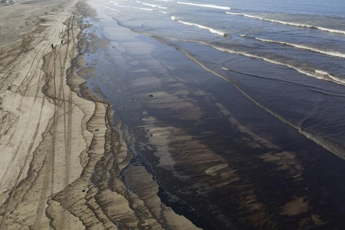 Oil pollutes Cavero beach in Ventanilla, Callao, Peru, on Tuesday after high waves attributed to the eruption of an undersea volcano in Tonga caused an oil spill.